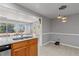 Modern kitchen featuring stainless steel appliances, island sink, and breakfast bar at 218 Parkview Dr, Venice, FL 34293