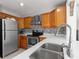 Well-equipped kitchen features stainless steel appliances, mosaic backsplash and plenty of counter space at 218 Parkview Dr, Venice, FL 34293