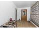Enclosed patio with patterned block wall, tile flooring and exterior access at 218 Parkview Dr, Venice, FL 34293