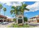 Charming Venice street view featuring palm trees, shops, and sunny skies on a bright day at 218 Parkview Dr, Venice, FL 34293