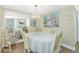 Elegant dining room with mirrored wall, chandelier, and a table set for a delightful meal at 22375 Edgewater Dr # 128, Port Charlotte, FL 33980