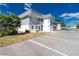 Two-story condo featuring ample parking and lush landscaping in a serene setting at 22375 Edgewater Dr # 128, Port Charlotte, FL 33980