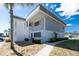 Two-story condo featuring well-maintained landscaping and a serene, inviting entranceway at 22375 Edgewater Dr # 128, Port Charlotte, FL 33980