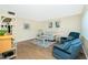 Cozy living room featuring comfortable seating, stylish decor, and lots of natural light at 22375 Edgewater Dr # 128, Port Charlotte, FL 33980