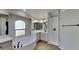 Spa-like bathroom featuring a soaking tub, walk-in shower, and modern fixtures, with bright natural light at 23344 Van Buren Ave, Punta Gorda, FL 33980