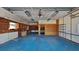 Spacious garage features ample storage, shelving, workbench, and blue sealed concrete flooring at 23344 Van Buren Ave, Punta Gorda, FL 33980