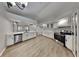 Modern kitchen featuring white cabinets, quartz countertops, and stainless steel appliances at 23344 Van Buren Ave, Punta Gorda, FL 33980
