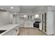 Modern kitchen with white cabinets, quartz countertops, and stainless steel appliances, perfect for cooking at 23344 Van Buren Ave, Punta Gorda, FL 33980