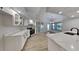 Bright kitchen with white cabinetry, quartz counters and stainless steel appliances for stylish cooking at 23344 Van Buren Ave, Punta Gorda, FL 33980