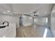 Bright living room with laminate floors, ceiling fan and recessed lighting for a modern feel at 23344 Van Buren Ave, Punta Gorda, FL 33980