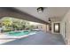 Relax in this covered lanai overlooking the inviting pool, a perfect outdoor oasis at 23344 Van Buren Ave, Punta Gorda, FL 33980