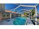 Enjoy the outdoors with a screened-in pool and patio area perfect for relaxation and entertainment at 23344 Van Buren Ave, Punta Gorda, FL 33980