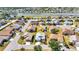 Aerial view of a neighborhood featuring beautiful landscaping, golf courses, and waterways at 24317 Kintail Ct, Punta Gorda, FL 33980