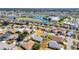 Beautiful aerial view of a well-maintained home in a community with a lake and golf course at 24317 Kintail Ct, Punta Gorda, FL 33980