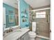 Bathroom featuring a glass-enclosed shower and a single sink with a large mirror at 24317 Kintail Ct, Punta Gorda, FL 33980