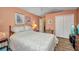 Bedroom featuring soft paint and trim colors, wood floors, and a dresser at 24317 Kintail Ct, Punta Gorda, FL 33980