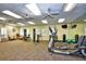 Well-equipped fitness center featuring various exercise machines, free weights, and ample space for workouts at 24317 Kintail Ct, Punta Gorda, FL 33980