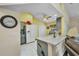 Eat-in kitchen with stainless steel appliances, a kitchen island, and a ceiling fan at 24317 Kintail Ct, Punta Gorda, FL 33980