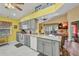 Open kitchen with modern appliances and gray cabinets, open to the living area at 24317 Kintail Ct, Punta Gorda, FL 33980
