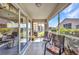 Relaxing screened lanai with seating area, perfect for enjoying the outdoors, and tiled flooring at 24317 Kintail Ct, Punta Gorda, FL 33980