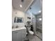 Updated bathroom with walk in shower, modern vanity, and hexagonal tile flooring at 25188 Marion Ave # 1004, Punta Gorda, FL 33950