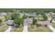 Aerial view of a charming two-story home with well maintained landscaping in a lush residential neighborhood at 26100 Paysandu Dr, Punta Gorda, FL 33983
