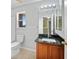 This bathroom features a shower-tub combo and a granite-topped single sink vanity at 26100 Paysandu Dr, Punta Gorda, FL 33983