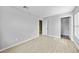 This bedroom features wood-look flooring and two entryways into other rooms at 26100 Paysandu Dr, Punta Gorda, FL 33983