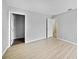 Bright bedroom featuring wood floors, neutral walls, and closet at 26100 Paysandu Dr, Punta Gorda, FL 33983
