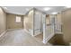 Hallway with wood-look flooring leads to staircase and other rooms at 26100 Paysandu Dr, Punta Gorda, FL 33983