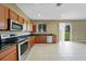 Bright kitchen features stainless steel appliances and sliding glass door access to the yard at 26100 Paysandu Dr, Punta Gorda, FL 33983
