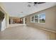 Open-concept living area featuring modern floors, natural light, and seamless kitchen access at 26100 Paysandu Dr, Punta Gorda, FL 33983