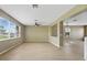 Spacious living room with hardwood floors and ample windows providing natural light at 26100 Paysandu Dr, Punta Gorda, FL 33983