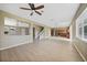 Bright, open floor plan with hardwood floors connecting the living area to the kitchen at 26100 Paysandu Dr, Punta Gorda, FL 33983