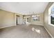 Open-concept living room with wood floors and neutral walls at 26100 Paysandu Dr, Punta Gorda, FL 33983