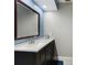 Upgraded bathroom featuring a stylish vanity with a large mirror and modern fixtures at 2751 S Cranberry Blvd, North Port, FL 34286