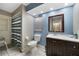 Charming bathroom with blue walls, a tiled shower with curtain, and a modern vanity at 2751 S Cranberry Blvd, North Port, FL 34286