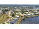 This sunny aerial shot highlights homes with personal docks along the waterfront in a quiet neighborhood at 318 Spring Lake Nw Blvd, Port Charlotte, FL 33952