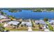 Stunning aerial shot showcasing waterfront homes with private docks along a tranquil canal at 318 Spring Lake Nw Blvd, Port Charlotte, FL 33952