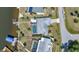 Aerial view of waterfront homes with docks and screened-in pools at 318 Spring Lake Nw Blvd, Port Charlotte, FL 33952