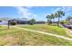 Expansive backyard leading to the water and private docks, with screened lanais at 318 Spring Lake Nw Blvd, Port Charlotte, FL 33952