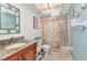 Bathroom featuring granite counter, framed mirror and shower stall at 318 Spring Lake Nw Blvd, Port Charlotte, FL 33952