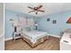 Bedroom with wood floors and ceiling fan at 318 Spring Lake Nw Blvd, Port Charlotte, FL 33952