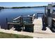 Scenic dock view featuring comfortable seating and direct access to tranquil waters at 318 Spring Lake Nw Blvd, Port Charlotte, FL 33952