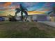 Charming single-story home featuring a well-manicured lawn and attached two-car garage at 318 Spring Lake Nw Blvd, Port Charlotte, FL 33952