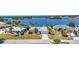 Beautiful waterfront home with well-maintained landscaping and a long driveway at 318 Spring Lake Nw Blvd, Port Charlotte, FL 33952