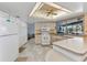 Functional kitchen with white appliances, plenty of cabinet space, and convenient layout at 318 Spring Lake Nw Blvd, Port Charlotte, FL 33952