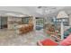 Open kitchen and living area with seating and direct access to outdoor pool at 318 Spring Lake Nw Blvd, Port Charlotte, FL 33952