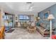 Cozy living room featuring comfortable seating, water views, and ample natural light at 318 Spring Lake Nw Blvd, Port Charlotte, FL 33952
