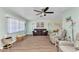 Bright and airy living room with wood flooring, light green walls, and comfortable furnishings at 318 Spring Lake Nw Blvd, Port Charlotte, FL 33952